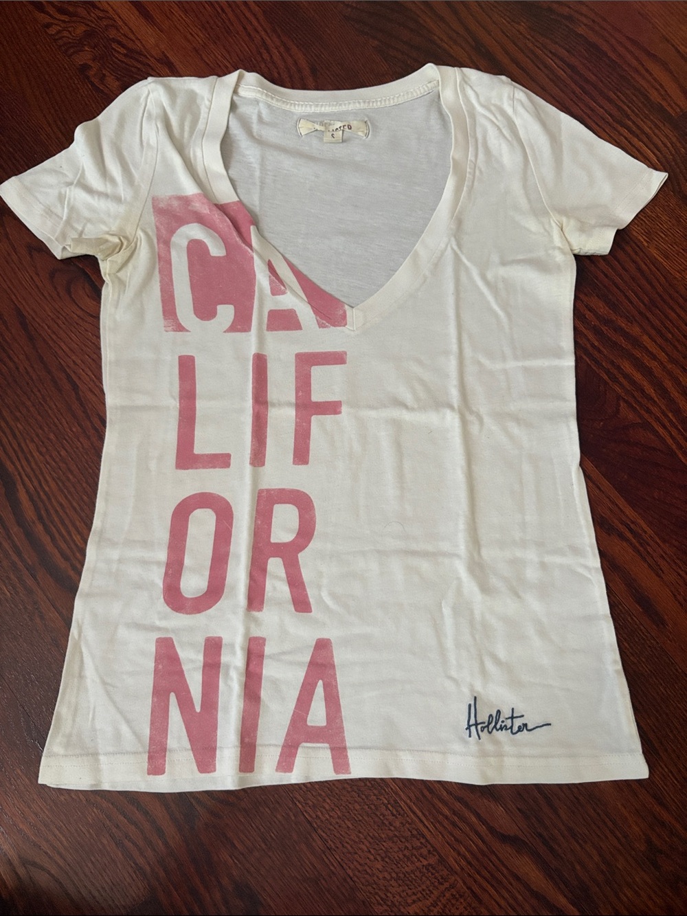 Hollister White V-Neck Tee with Pink California Graphic